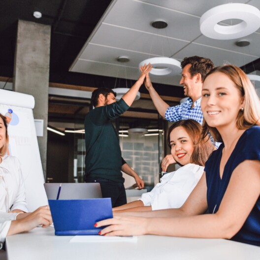 Business people work together in an office interior.